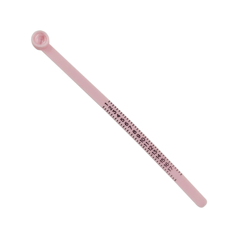 Measure the size of your finger with a magnifying glass ring and a ring tape measure