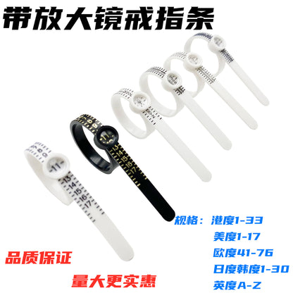 Measure the size of your finger with a magnifying glass ring and a ring tape measure