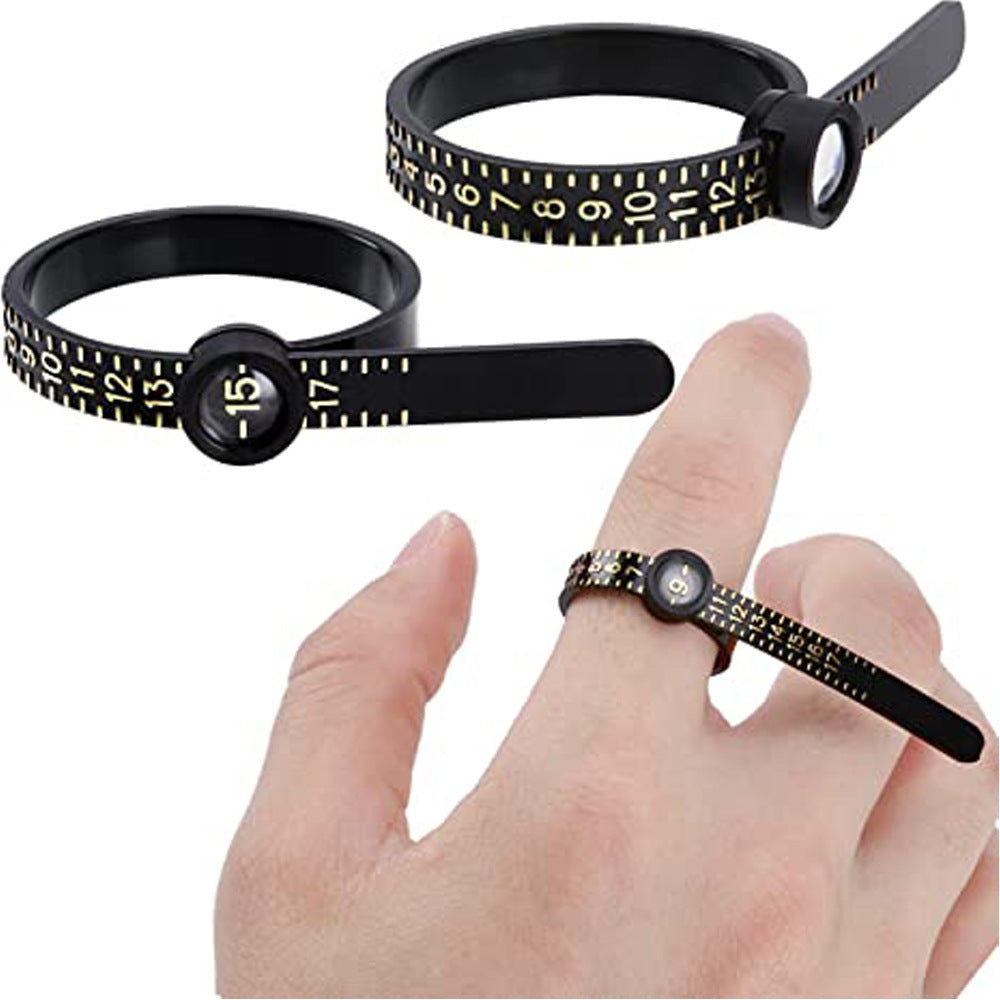 Measure the size of your finger with a magnifying glass ring and a ring tape measure